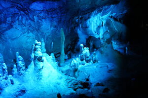 Hermanns Cave Germany Stalactite formation illuminated in blue